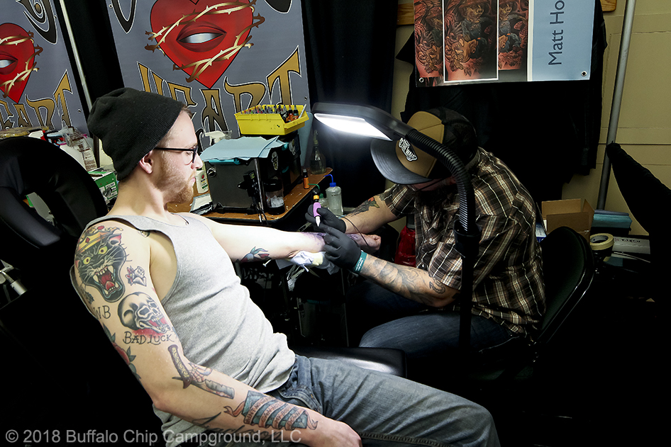A man gets some fresh in at the Tattoo Expo.
