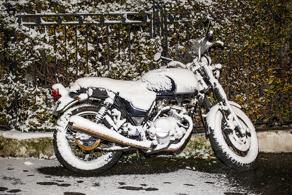 Snow Covered Motorcycle during a Minnesota Winter