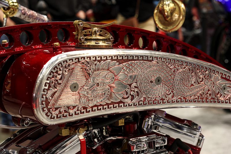 A custom chopper with a gleaming chrome finish, showcasing the intricate craftsmanship of Donnie Smith Custom Choppers.